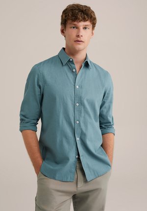 Mint green long-sleeve button-up shirt with a spread collar, roll-up sleeves, and subtle texture. Plain front with matching buttons.