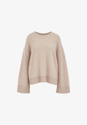 Bež pulover v oversize slogu z mehko, teksturirano površino, okroglim ovratnikom in širokimi rokavi. Ribljen rob in manšete dodajajo detajle.