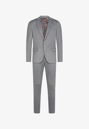 Harmaa puku räätälöidyllä istuvuudella, jossa on nappikaulus, kaksi nappia ja syvän sinisen ja oranžin sävyissä kuvioitu sisävuori.