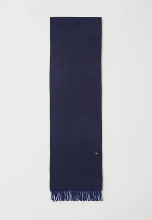 Scarf intrecciato blu navy con motivo a spina di pesce, rifinito con bordi frangiati e una piccola etichetta con logo a un'estremità.