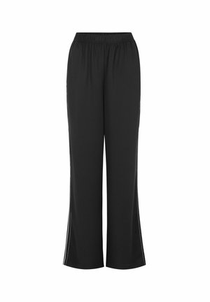 Melnas, vieglas bikses ar elastīgu jostu, platiem galiem un sānu šķēlumiem. Sānos baltas dekoratīvās šuves.