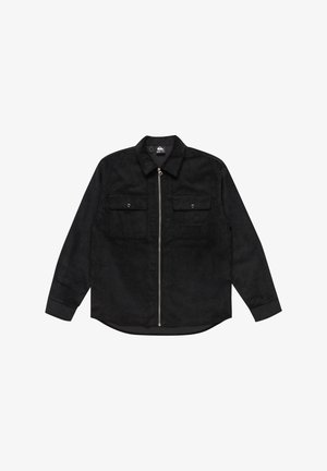 Čierna kordurová košeľa s golierom, predným zapínaním na zips, dvomi vreckami na hrudi a dlhými rukávmi, s jemným textúrovaným vzorom.