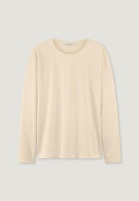 Langarm-T-Shirt in hellem Beige, runder Ausschnitt, weicher Stoff, lockere Passform, minimale Nähte, ohne sichtbare Muster oder Grafiken.