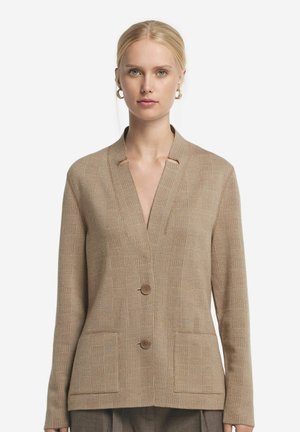 Cardigan beige a maniche lunghe con scollo a V, due tasche frontali e chiusura a bottoni. Tessuto testurizzato con un sottile motivo a quadretti.
