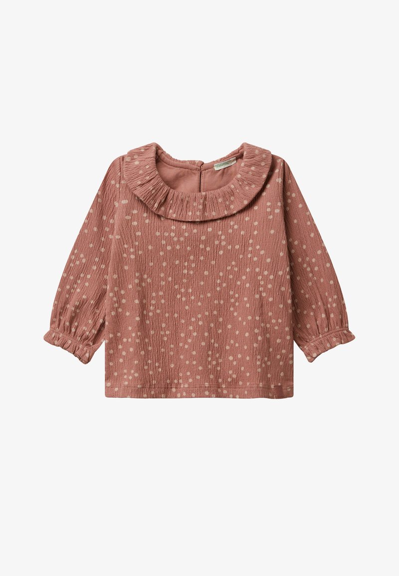 Rosa Langarmshirt mit Rüschenausschnitt, strukturiertem Stoff und weißen Punkten. Mit gerafften Ärmeln und Knopfverschluss hinten.