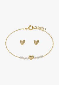 Geselecteerd, gold-coloured