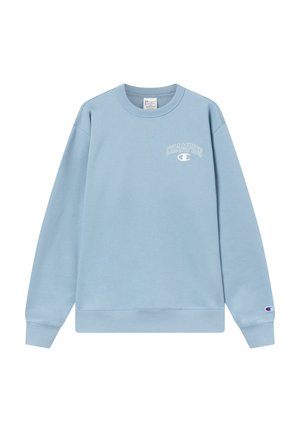 Sudadera azul clara de algodón, con cuello redondo, mangas largas y un pequeño logo "CHAMPION" en el pecho. Corte clásico.