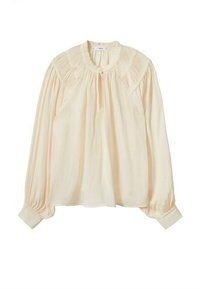 Blusa leggera color crema con maniche lunghe a sbuffo, scollatura a occhiello e dettagli arricciati sulle spalle. Tessuto morbido e leggero.