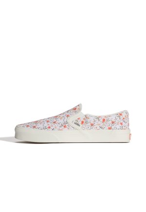 Slip-on Vans-sneaker med hvid sål og overdel dækket af små orange og grønne blomsterprint.