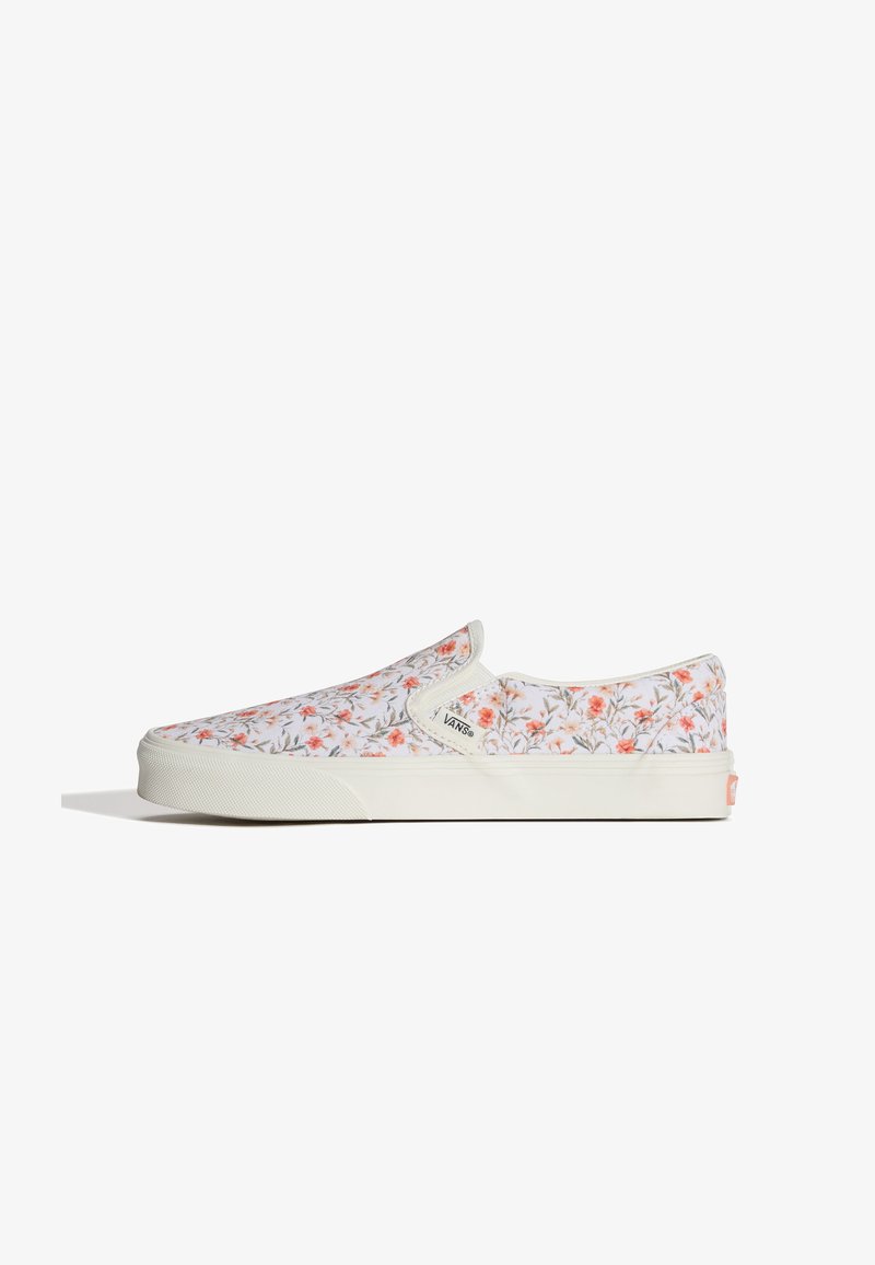 Baskets Vans à enfiler avec semelle blanche et dessus recouvert d'un petit imprimé floral orange et vert.