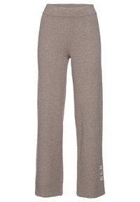 Graue weite Sweatpants mit elastischem Bund, aus weichem Material, mit einem weißen Logoakzent auf der linken Seite.
