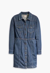 Denimmekko pitkillä hihoilla, nappikiinnitys edessä ja kaksi rintataskua. Siinä on vartalonmyötäinen vyötärö ja pehmeä koostumus keskisinisessä pesussa.
