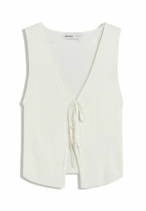 White ribbed sleeveless top with a deep V-neck and front tie closure. Soft texture, relaxed fit, and curved hemline for a casual look.