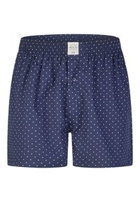 Boxer pour hommes bleu marine à pois blancs, taille élastique, bouton avant et étiquette de marque sur la ceinture.
