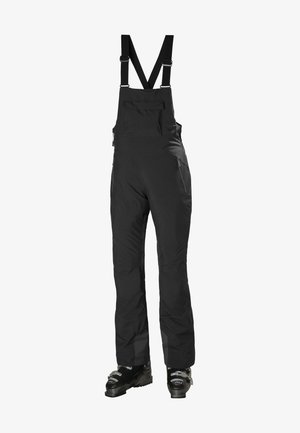 Czarne, wodoodporne spodnie na szelkach z regulowanymi ramiączkami, zamkami błyskawicznymi w kieszeniach oraz wzmocnionymi nogawkami, zaprojektowane do aktywności w zimnych warunkach.