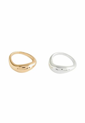 Two smooth, irregularly shaped rings, one gold and one silver, displayed on a white background.