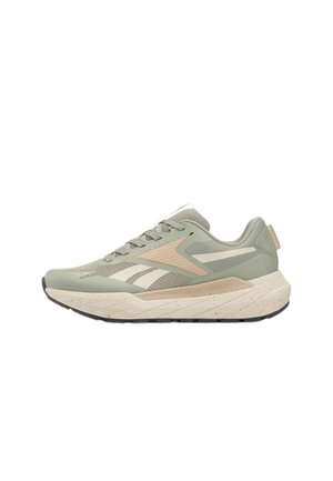 Lichtgroene en beige hardloopschoen met gestructureerde zool, mesh bovenwerk en Reebok-logo op de zijkant en hieltab.