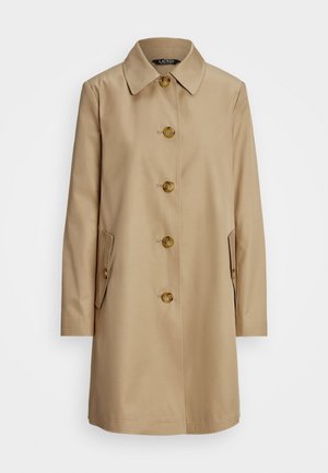 Vaaleanruskea trenssitakki, jossa on kauluskervi, viisi nappia ja kaksi sivutaskua. Takissa on sileä pinta ja suora leikkaus.