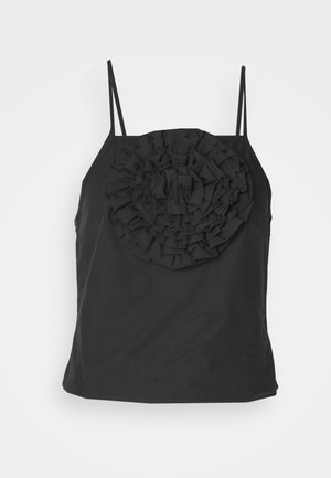Black sleeveless top featuring a large ruffled floral design on the front, made of smooth fabric, with thin spaghetti straps.