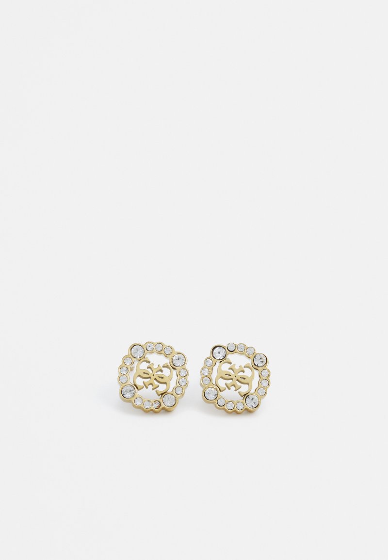 Boucles d'oreilles en métal doré en forme florale décorative, ornées de plusieurs cristaux transparents disposés autour d'un motif central.