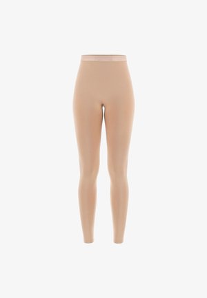 Leggings nude au design ajusté, fabriqués en tissu lisse et extensible. Dotés d'une fine ceinture élastique pour un maintien sécurisé.