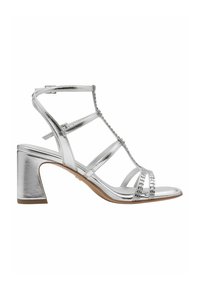 Silver heeled sandal with a block heel, featuring strappy design, metallic finish, and decorative rhinestone accents across the toe.