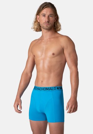 Sinised bokserid, mis on valmistatud siledast kangast, musta bränditud vöörihmaga ja mugava ning toetava sobivusega.