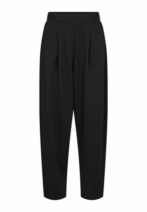 Mustat korkeavyötäröiset kapenevat housut, joissa on edessä laskokset ja leveä vyötärönauha, ja joiden lahkeet ovat rentoa mallia.