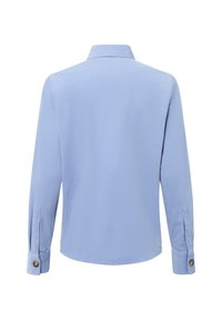 Light blue long-sleeve shirt with a standard collar, buttoned cuffs, and a smooth fabric texture. Features a relaxed fit.