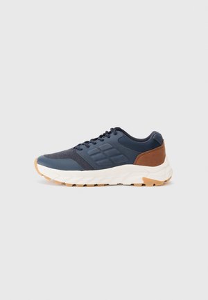 Navy blue athletic shoes with a brown heel accent, textured mesh upper, padded collar, and white rubber sole with a patterned tread.