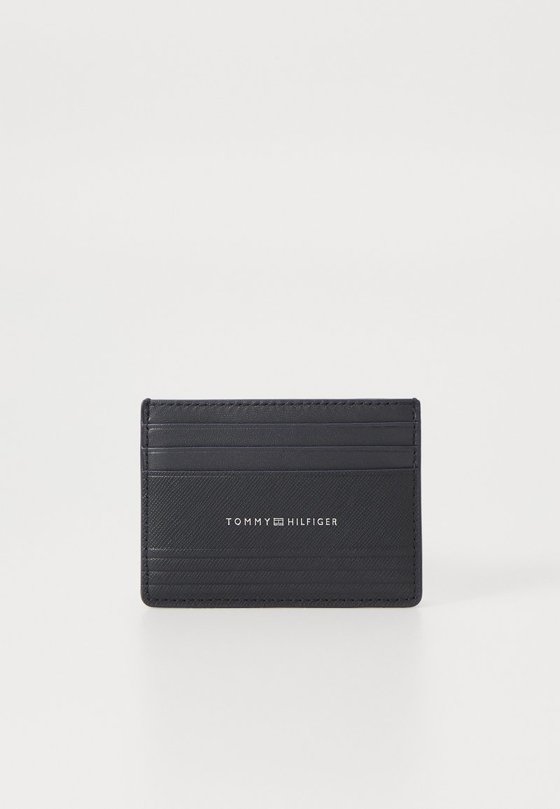 Black cardholder made of textured leather, featuring multiple card slots and embossed logo. Rectangular shape with clean lines.