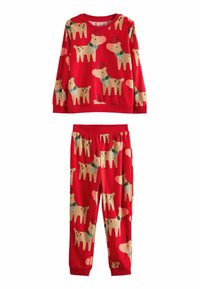 Punainen pyjamapuku, jossa on pitkähihaiseta paita ja housut, koristeltu bežipohjaisilla porokuvioilla, valmistettu pehmeästä kankaasta ja jossa on joustava vyötärö.
