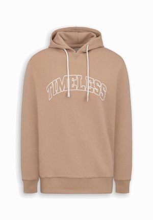 Beige huppari, jossa on valkoiset kiristysnauhat ja rintaosan yli suurilla valkoisilla ääriviivakirjaimilla painettu "TIMELESS"-teksti.