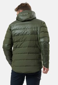 Green padded jacket with a hood, featuring a glossy finish, horizontal stitching, and long sleeves. Designed for warmth and insulation.