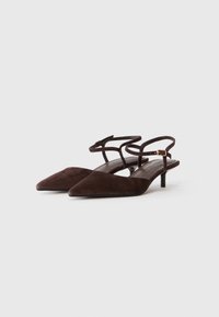Brown suede slingback shoes with a pointed toe, featuring a slender heel and two adjustable straps on the ankle for a secure fit.