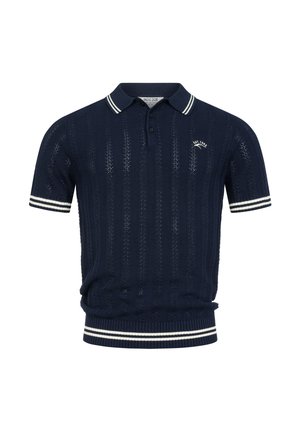 Granatowa krótka dzianinowa koszulka polo z białymi paskowanymi kołnierzem, mankietami i dołem, z małym logo „EST. 1992” na lewej piersi.