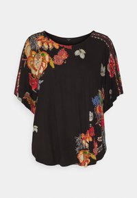 Svart topp med färgglad blommig broderi längs ena sidan. Mjuk tyg med lös passform och vida ärmar för komfort och rörelsefrihet.