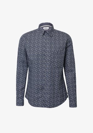 Granatowa koszula z długim rękawem, z kołnierzykiem typu spread i białym nieregularnym wzorem w kropki.