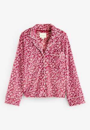 Punane lillemustriga pidžaamaülikond valgete detailidega. Omab võrdelist kraed, pikki käisi ja eesmist taskut. Valmistatud kergest kangast.