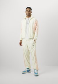 Nike Performance ICON PANT  - Træningsbukser - coconut milk/washed coral/black