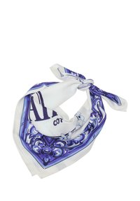 Cotton scarf in white, featuring blue decorative patterns. Ties at the top with a triangular shape and smooth texture.