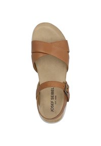 Brown leather sandal with crisscross straps, adjustable buckle, and cushioned insoles. Simple design with a flat sole and light texture.