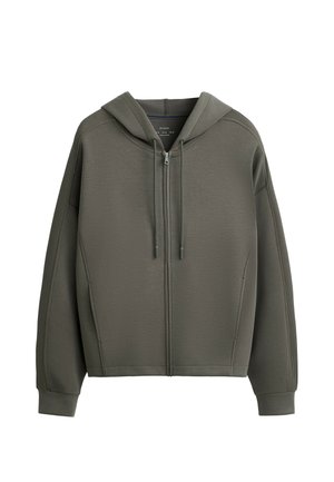 Hooded zip-up jacket in olive green. Features a textured fabric, relaxed fit, and ribbed cuffs. Double drawstrings at the hood.