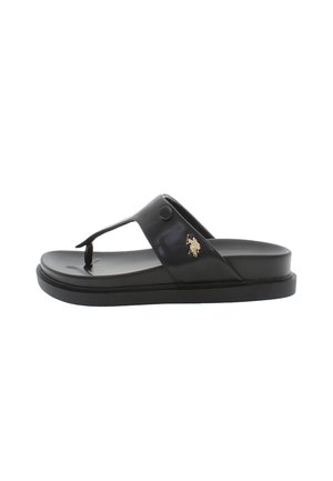 Svart läder flip-flop sandal med en bred rem, upphöjd sula och guld logotyp accent. Slät textur och rundad form.