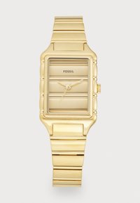 Goldene Quadrat-Uhr mit gebürsteter Oberfläche, geriffeltem Gehäuse und passendem Metallarmband. Verfügt über minimalistische Stundenmarkierungen und Fossil-Branding.