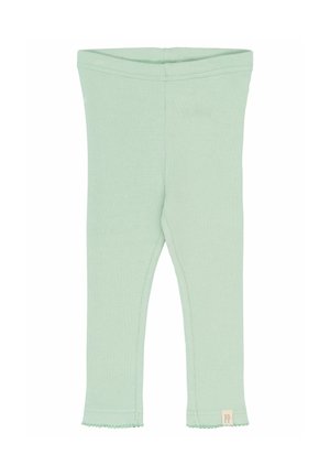 Helle grüne gerippte Leggings mit körperbetontem Design, gewelltem Saum und einem kleinen Etikett mit "PP" an der unteren linken Seite.