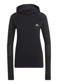Hoodie noir à manches longues en tissu texturé, avec des détails côtelés sur les épaules et les poignets, et un petit logo Adidas blanc sur la poitrine.