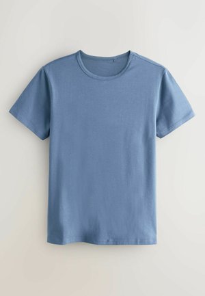 T-shirt à col rond et manches courtes en coton bleu doux. Présente une texture lisse avec une coupe décontractée, sans motifs ni accents visibles.