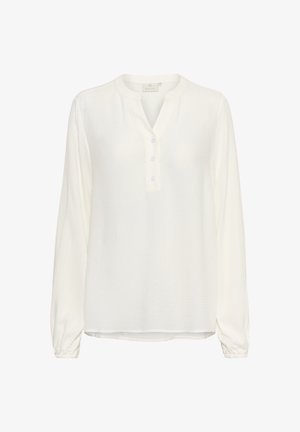 Hvit bluse med lange ermer i lett stoff med tekstur, med knappestolpe og rynkede mansjetter.
