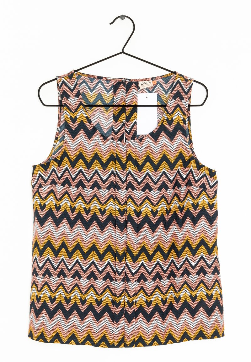 Haut sans manches sur un cintre noir, présentant un motif en zigzag en rose, blanc, jaune et noir. Le matériau semble léger avec une texture lisse.